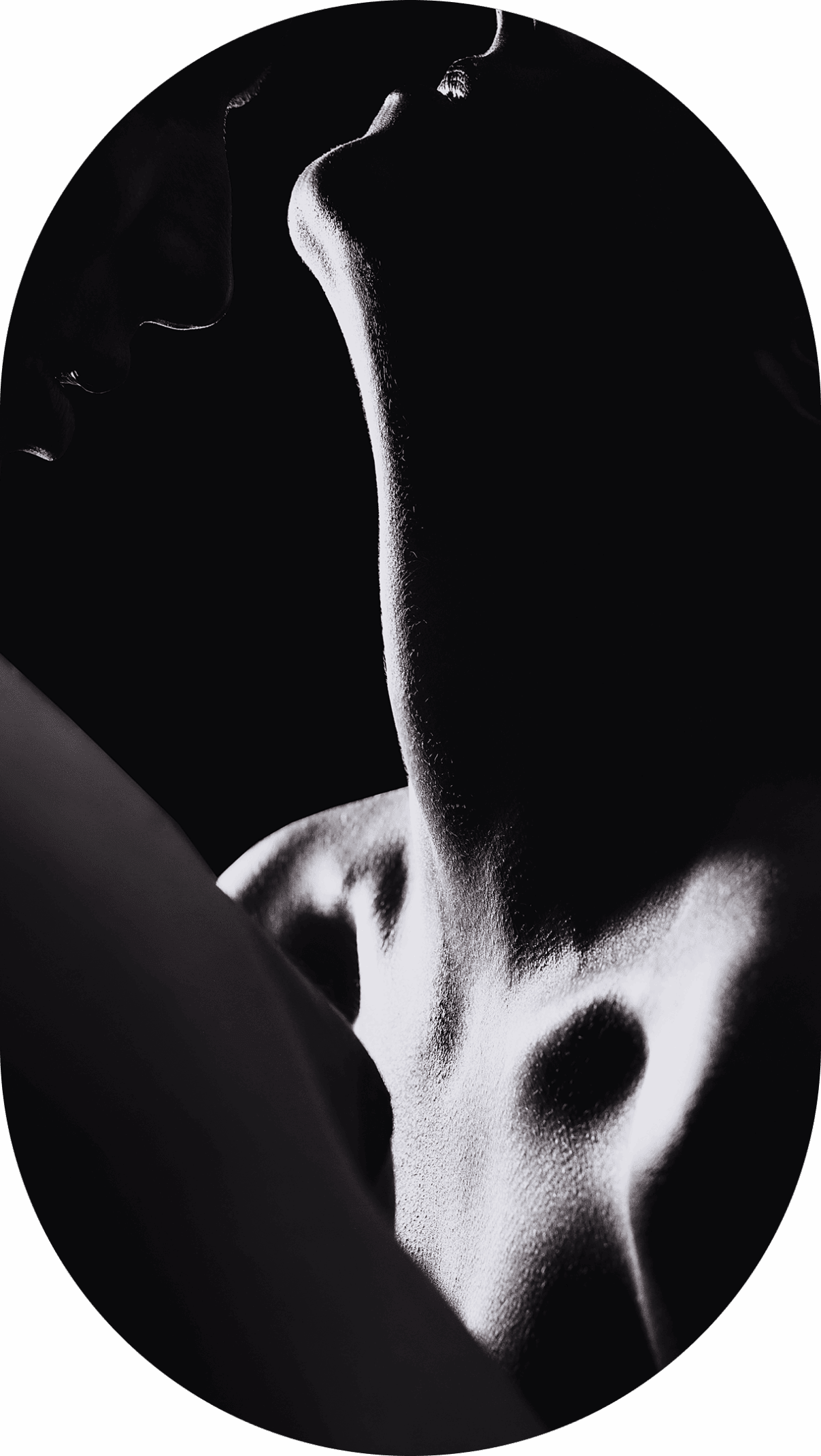 Silhouetted neck and shoulder in low light.