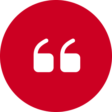 Red circle with white quotation marks icon.