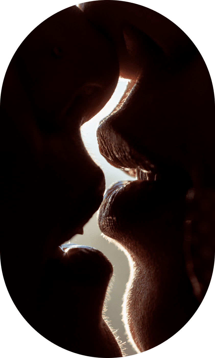 Close-up of two people about to kiss.